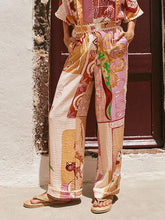 Pantalones anchos con bolsillo y ribete de encaje y estampado retro informal